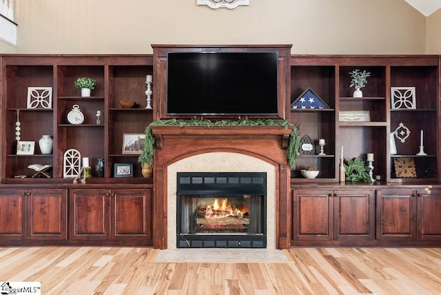 interior space with vaulted ceiling and light hardwood / wood-style floors