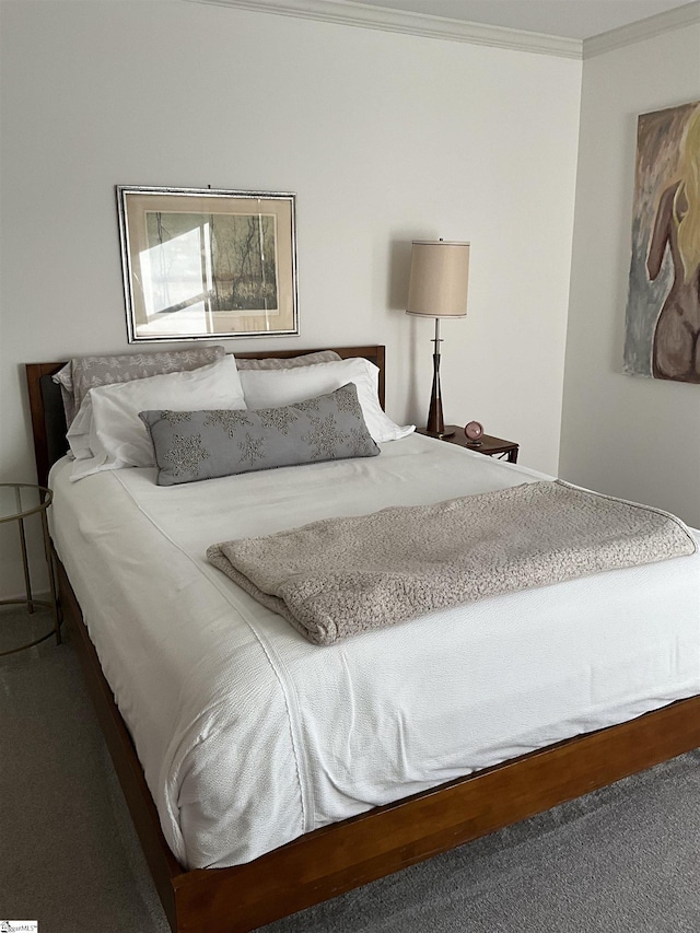 carpeted bedroom featuring ornamental molding