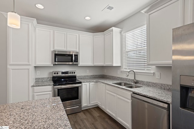 kitchen with white cabinetry, sink, and stainless steel appliances