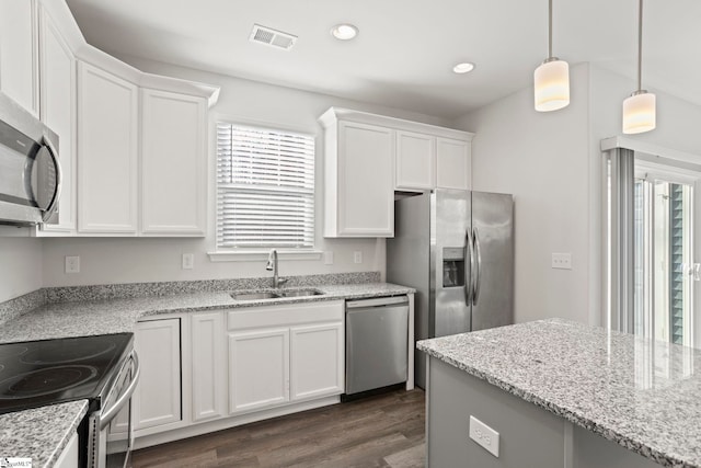 kitchen featuring sink, white cabinets, and appliances with stainless steel finishes