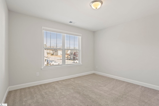 empty room featuring light colored carpet