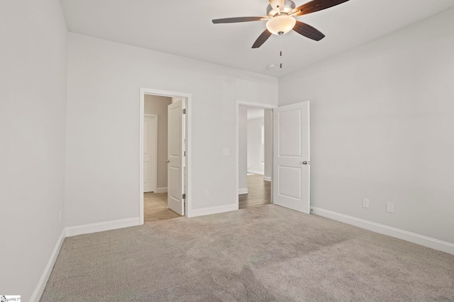 unfurnished bedroom with ceiling fan and light carpet