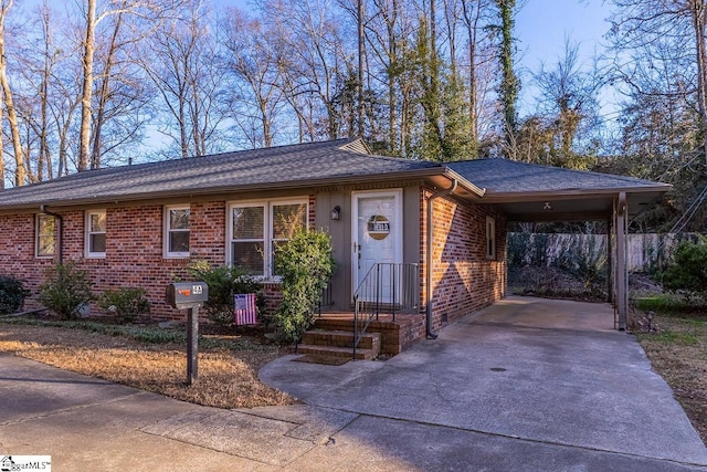 ranch-style home featuring a carport