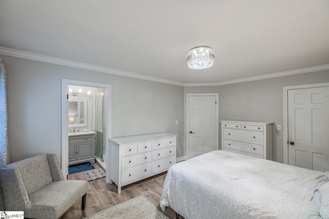 bedroom featuring ornamental molding, connected bathroom, and light hardwood / wood-style flooring