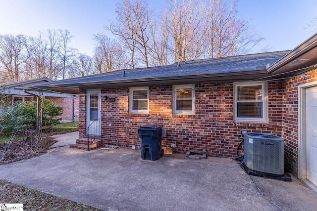 back of house with a patio and central air condition unit