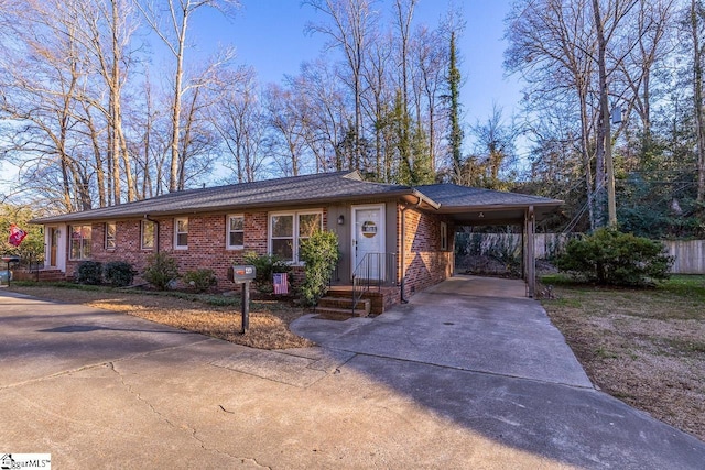 single story home featuring a carport