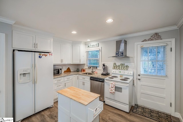 kitchen with white cabinetry, wall chimney range hood, sink, and appliances with stainless steel finishes