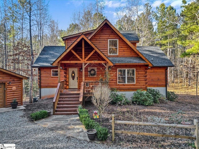 log cabin with log exterior and roof with shingles