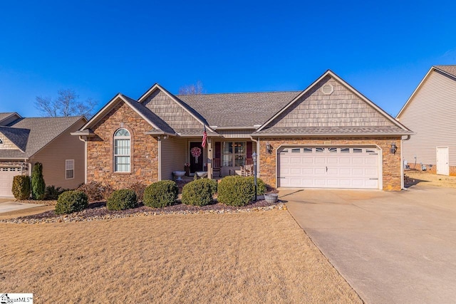 view of front of home featuring a garage and covered porch