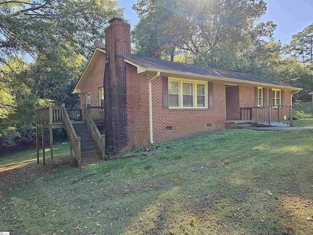 view of front of house featuring a deck and a front lawn