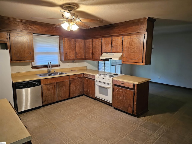 kitchen with ceiling fan, white appliances, sink, and a textured ceiling