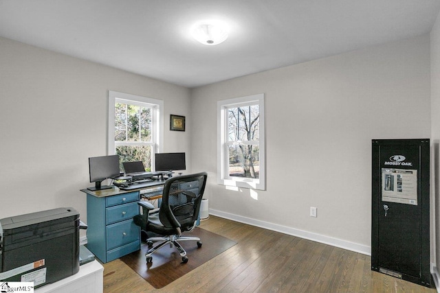 office with dark hardwood / wood-style flooring