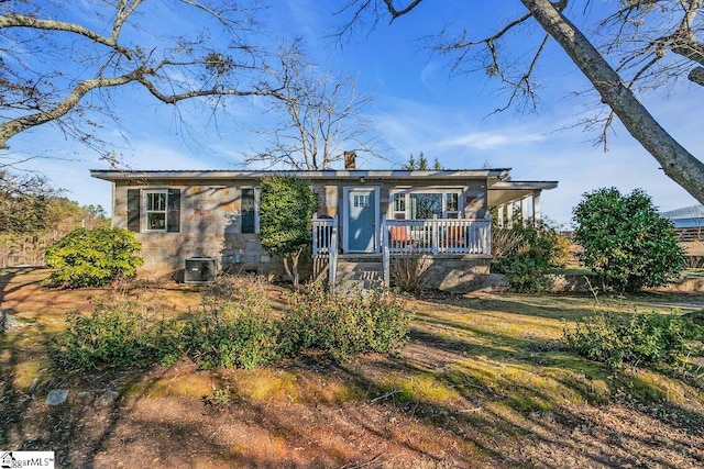 view of front of home with central air condition unit and covered porch