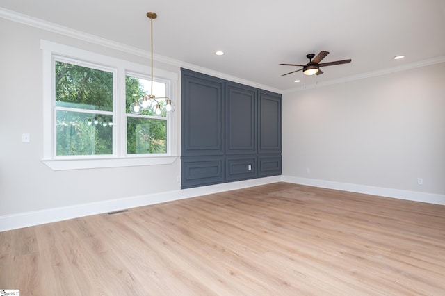 empty room with crown molding, ceiling fan, and light wood-type flooring