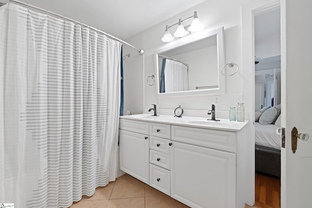 bathroom with vanity, tile patterned floors, and walk in shower