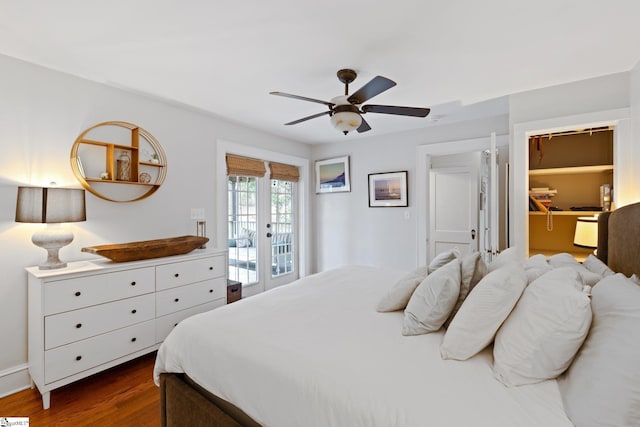 bedroom featuring french doors, dark wood-type flooring, a walk in closet, ceiling fan, and access to exterior