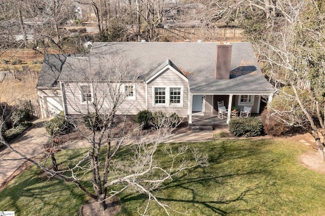 view of front of house with a patio area and a front yard