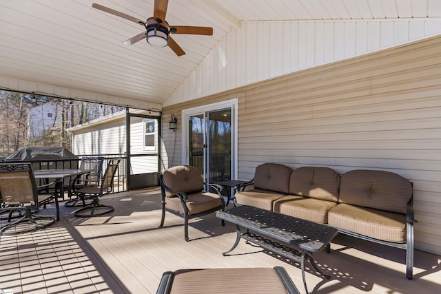 sunroom / solarium featuring vaulted ceiling and ceiling fan