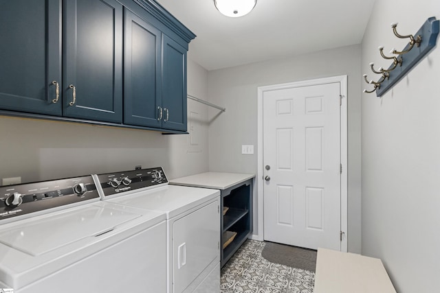 laundry area with independent washer and dryer and cabinets