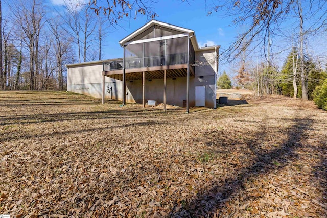 back of house featuring a sunroom