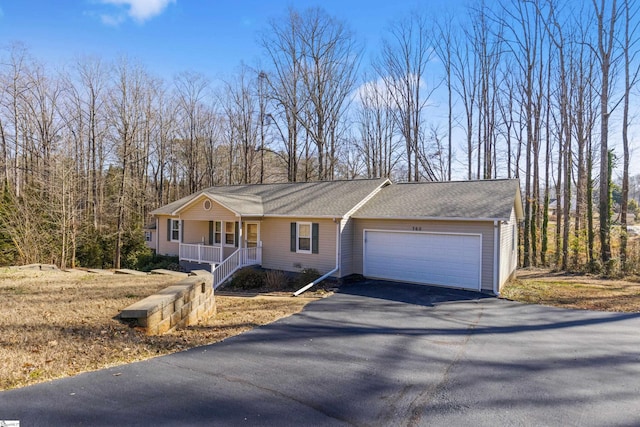 view of front of property featuring a garage and covered porch