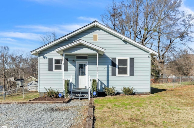 bungalow-style house featuring a front yard