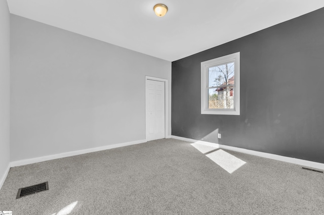 empty room with carpet flooring