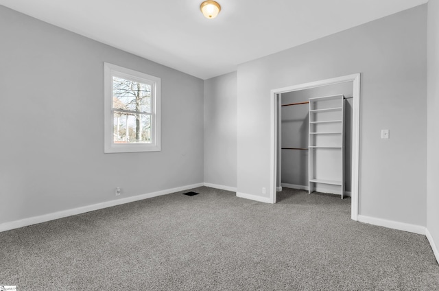 unfurnished bedroom with a closet and carpet