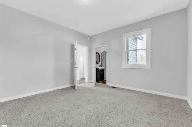 unfurnished bedroom with carpet floors