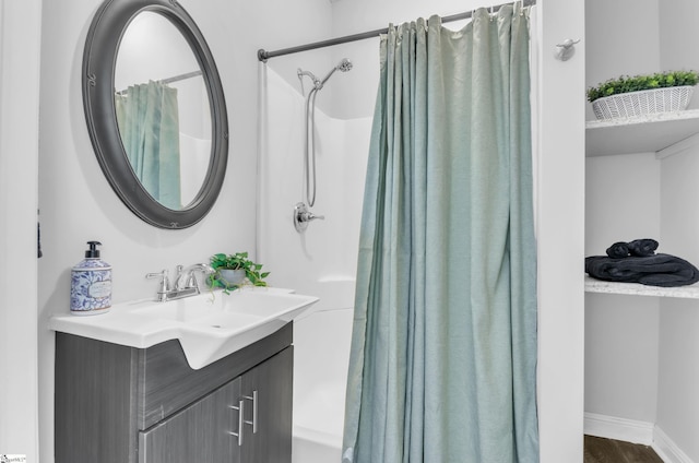 bathroom featuring vanity and hardwood / wood-style floors