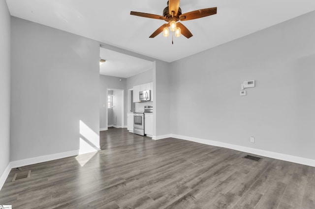 unfurnished living room with ceiling fan and dark hardwood / wood-style flooring