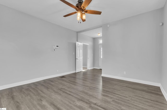 empty room with hardwood / wood-style flooring and ceiling fan