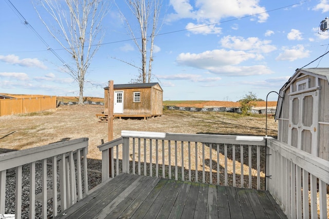 wooden deck featuring a storage shed