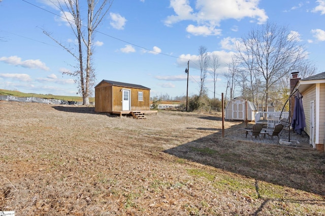 view of yard with a storage shed