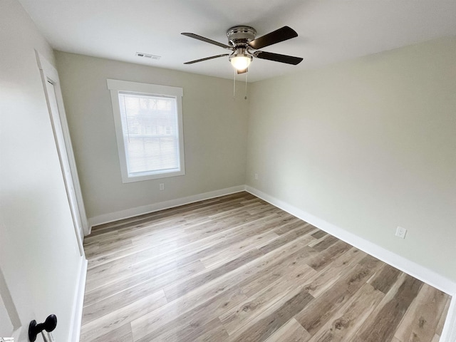 empty room featuring light hardwood / wood-style floors and ceiling fan