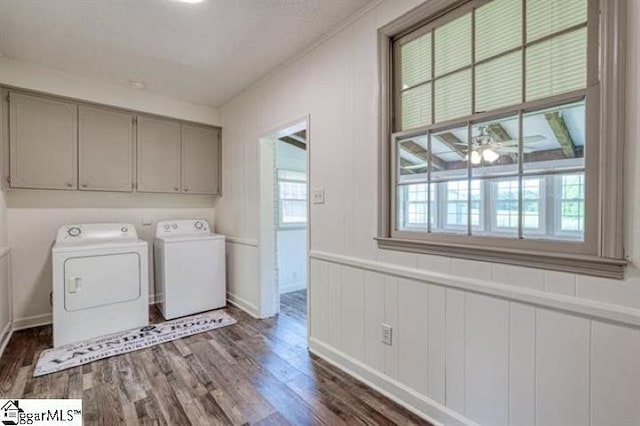 laundry area featuring cabinets, ceiling fan, washer and dryer, and dark hardwood / wood-style flooring