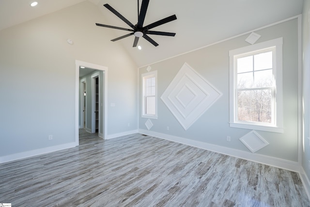 interior space with high vaulted ceiling, light hardwood / wood-style floors, and ceiling fan