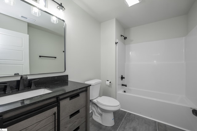 full bathroom with vanity, toilet, and washtub / shower combination