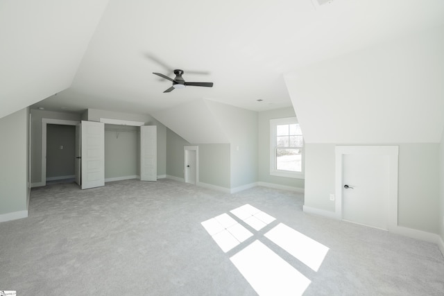 bonus room featuring lofted ceiling, light colored carpet, and ceiling fan