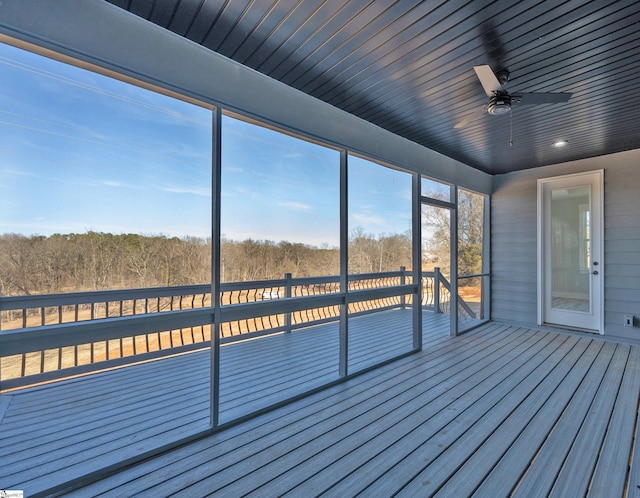 unfurnished sunroom with wooden ceiling and ceiling fan