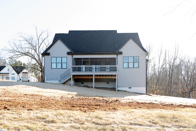 rear view of house with a sunroom