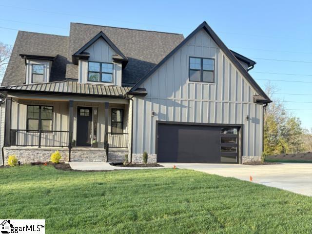 109 Horseshoe Bend Rd, Easley, SC 29642 - modern inspired farmhouse featuring concrete driveway, board and batten siding, a porch, a front lawn, and roof with shingles