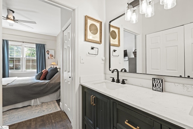 bathroom featuring vanity, wood-type flooring, and ceiling fan