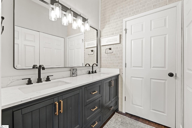 bathroom with vanity and tile walls