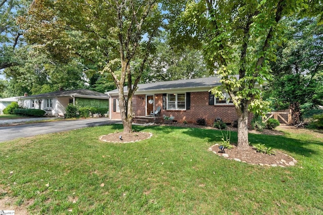 ranch-style house with a front yard