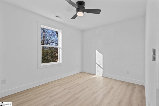 empty room featuring ceiling fan and light hardwood / wood-style floors