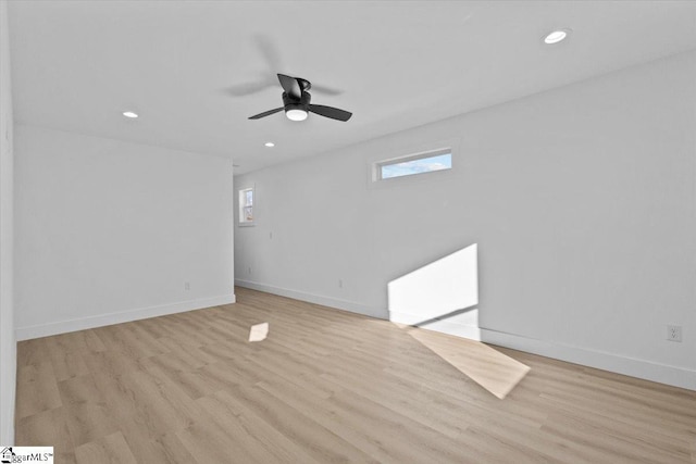 spare room with ceiling fan and light hardwood / wood-style floors