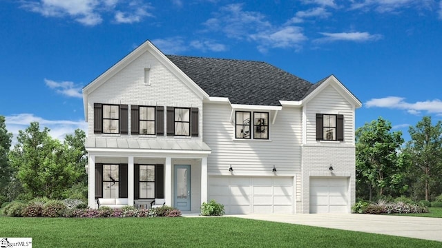 view of front of property with a garage and a front lawn