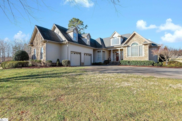 view of front facade with a garage and a front lawn