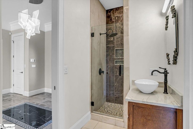 bathroom with tile patterned flooring, sink, and a shower with shower door